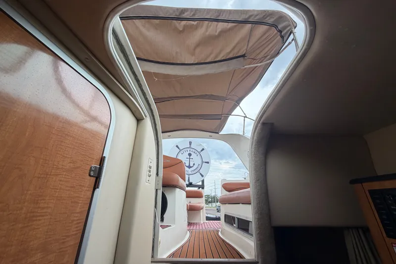 Slide: The Image of Interior view of 2003 Maxum 2900 SE boat with open canopy and seating area. - 86