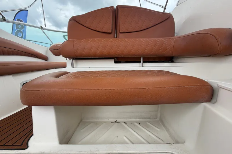 Slide: The Image of Brown leather seating on 2003 Maxum 2900 SE boat, featuring diamond stitching. - 24