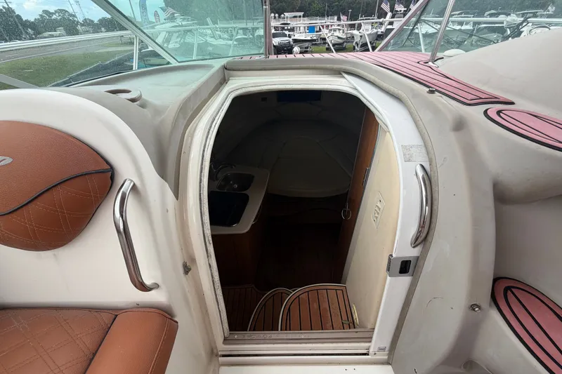 Slide: The Image of 2003 Maxum 2900 SE boat interior entrance with seating and cabin view. - 52