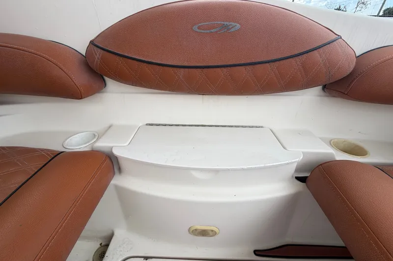 Slide: The Image of Brown leather seating on a 2003 Maxum 2900 SE boat interior. - 25