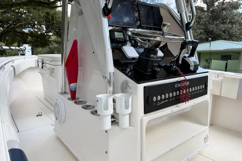 Slide: The Image of 2007 Contender 23 Tournament boat console with steering wheel and controls. - 10