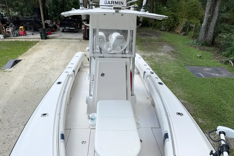 Slide: The Image of 2007 Contender 23 Tournament boat with Garmin equipment, parked on grassy area. - 15