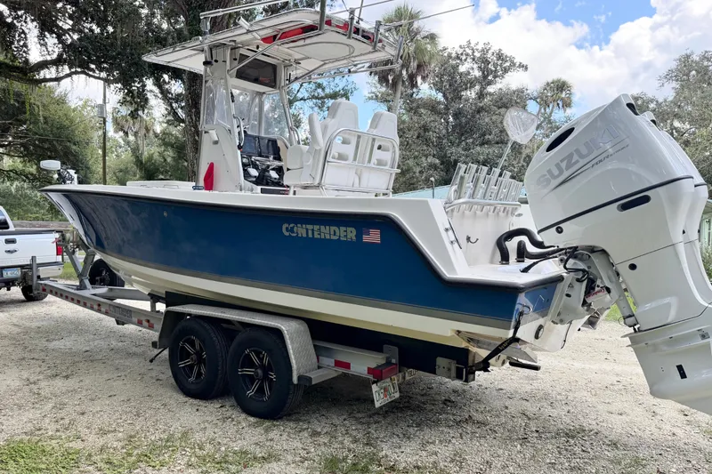 Slide: The Image of 2007 Contender 23 Tournament boat on trailer with Suzuki outboard motor. - 7