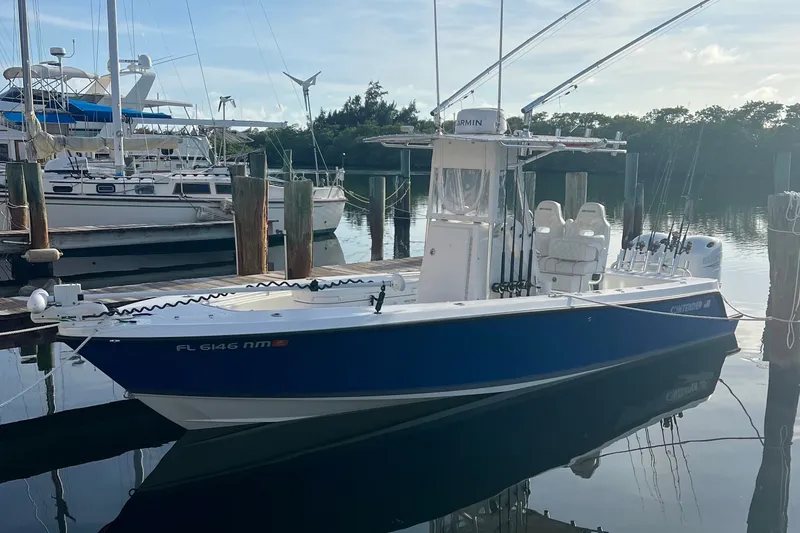 The Image of 2007 Contender 23 Tournament boat docked in a marina, surrounded by other vessels. - 9