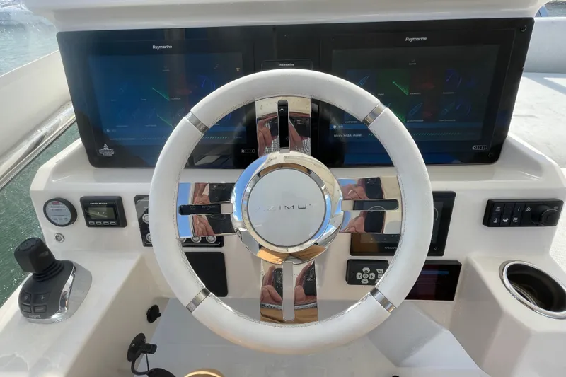 Slide: The Image of Flybridge helm with Raymarine displays. - 53