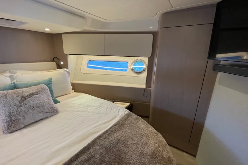 Slide: The Image of Luxurious guest bedroom interior of 2023 Azimut Fly 50 yacht with ocean view window. - 9