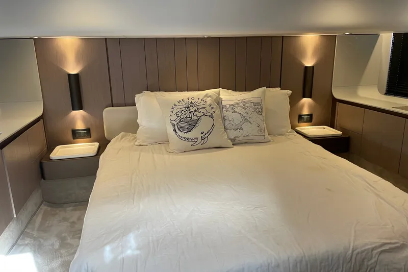 Slide: The Image of Luxurious master bedroom interior of 2023 Azimut Fly 50 yacht with elegant lighting and decor. - 12