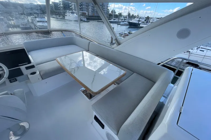 Slide: The Image of Flybridge dining and seating looking starboard. - 54