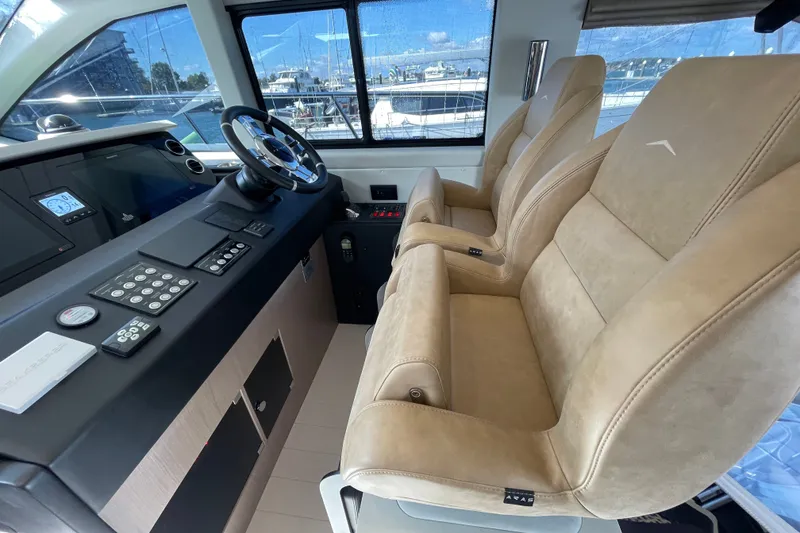 Slide: The Image of Helm seating and vessel controls. - 23