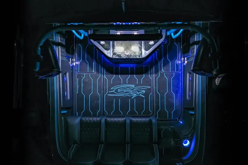 Slide: The Image of Interior of 2025 Glasstream 32 GSX boat with blue LED lighting and sleek design. - 14