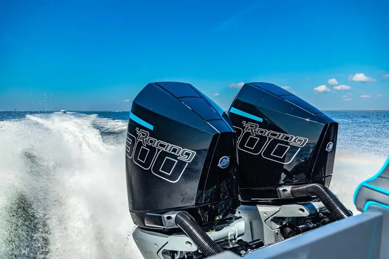 Slide: The Image of 2025 Glasstream 32 GSX boat with dual Racing 300 engines on open water. - 16