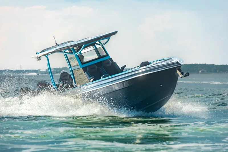 Slide: The Image of 2025 Glasstream 32 GSX boat cruising on open water, showcasing sleek design and performance. - 11