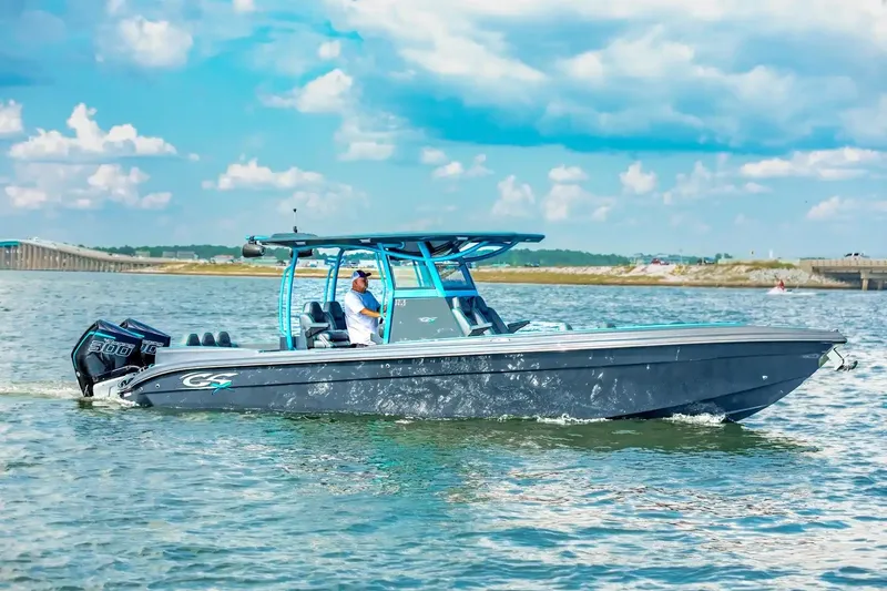 Slide: The Image of 2025 Glasstream 32 GSX boat cruising on a sunny day with blue skies. - 0