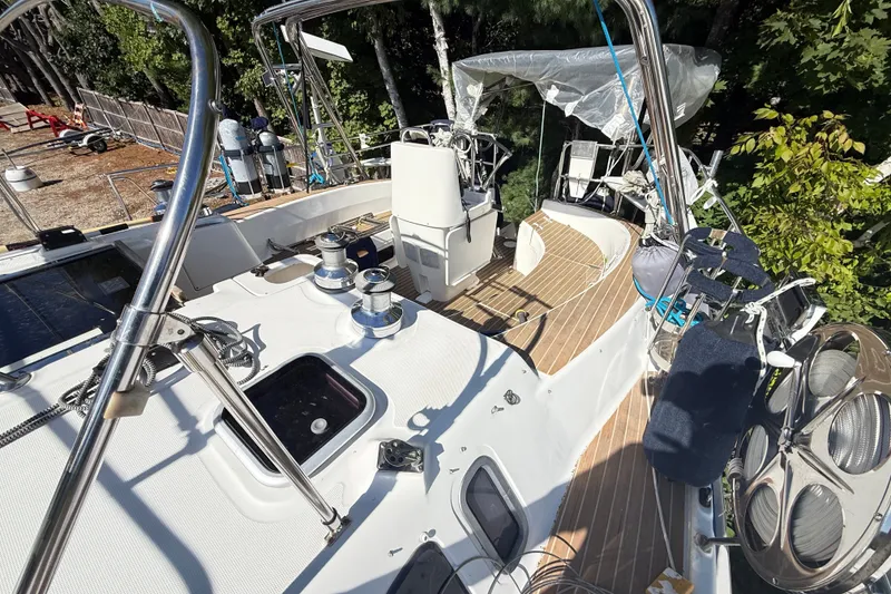 Slide: The Image of Deck view of a 2000 Hunter 460 sailboat with winches and teak flooring. - 14