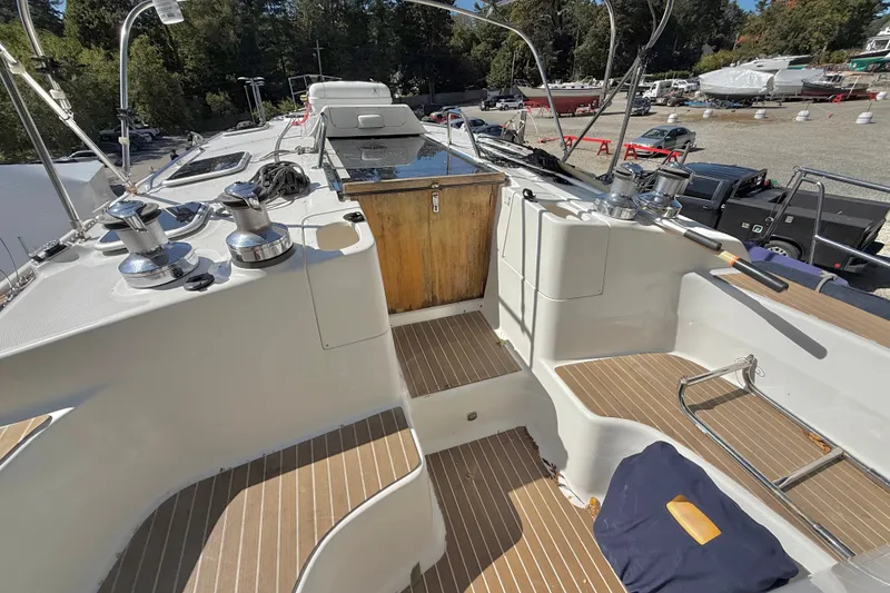 Slide: The Image of Deck view of a 2000 Hunter 460 sailboat with winches and seating. - 21
