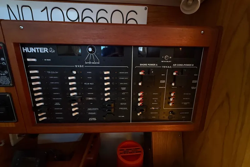 Slide: The Image of Electrical control panel on a 2000 Hunter 460 yacht, featuring various switches and indicators. - 45