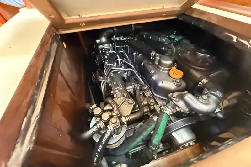 Slide: The Image of Engine compartment of a 2000 Hunter 460 sailboat, showcasing mechanical components. - 67