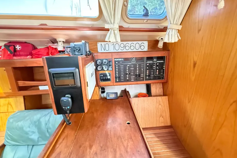 Slide: The Image of Interior of a 2000 Hunter 460 sailboat with navigation equipment and control panel. - 43