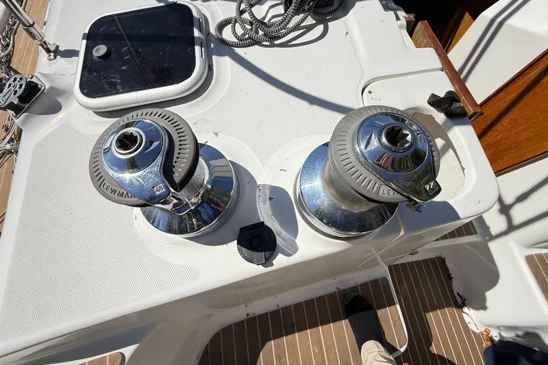 Slide: The Image of Deck of 2000 Hunter 460 sailboat featuring Lewmar winches and hatch. - 16