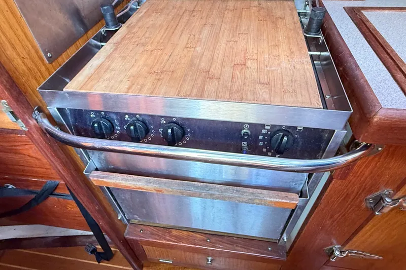 Slide: The Image of Stainless steel stove with wooden countertop in 2000 Hunter 460 yacht kitchen. - 31