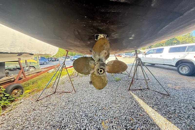 Slide: The Image of Underneath view of a 2000 Hunter 460 sailboat with visible propeller and supports. - 72