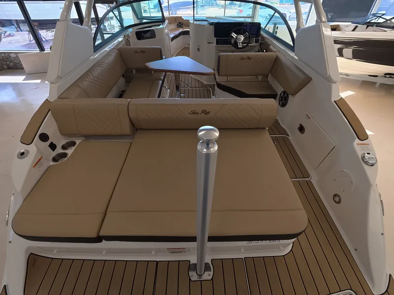 Slide: The Image of The image shows the interior of a 2026 Sea Ray SDX 230 Outboard with beige seating. - 5