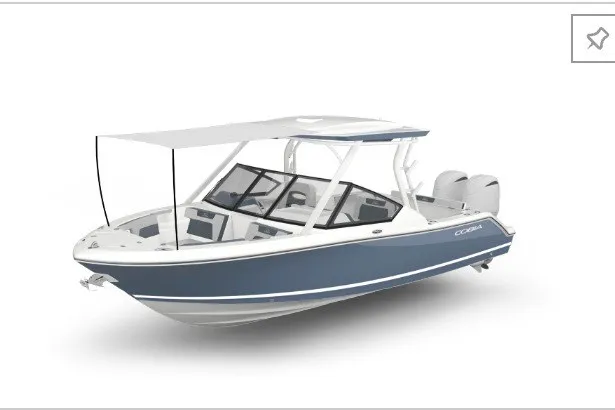 Slide: The Image of 2027 Cobia 250 Dual Console boat with sleek design and dual engines. - 20