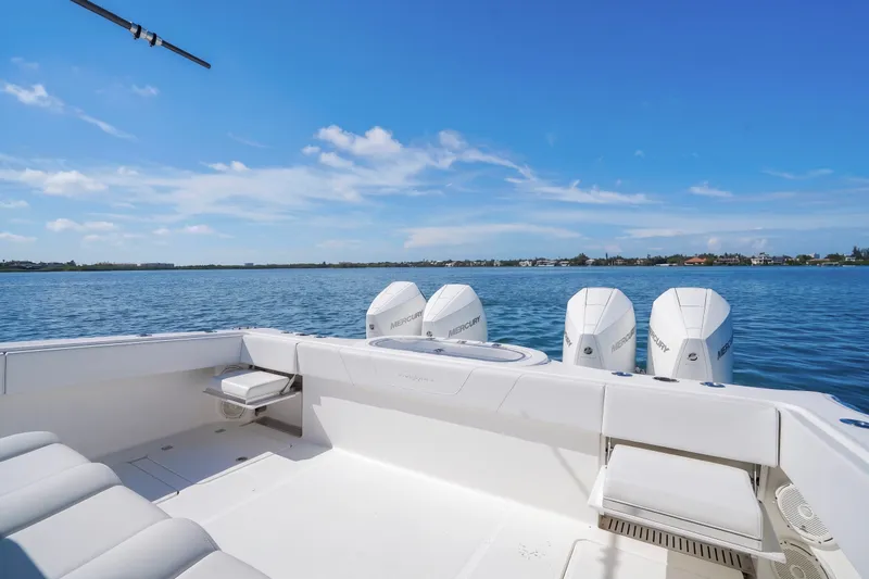 Slide: The Image of 2019 Invincible 37 Catamaran with triple Mercury engines on calm water. - 17