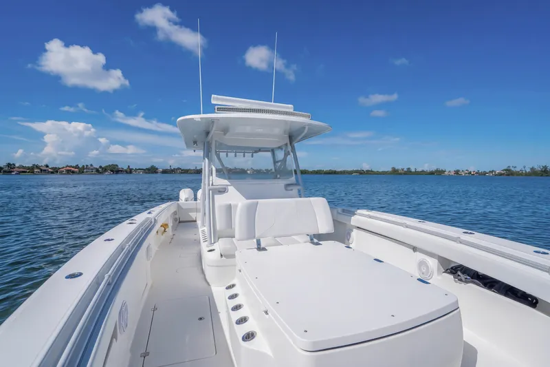 Slide: The Image of 2019 Invincible 37 Catamaran on calm water under clear blue sky. - 19