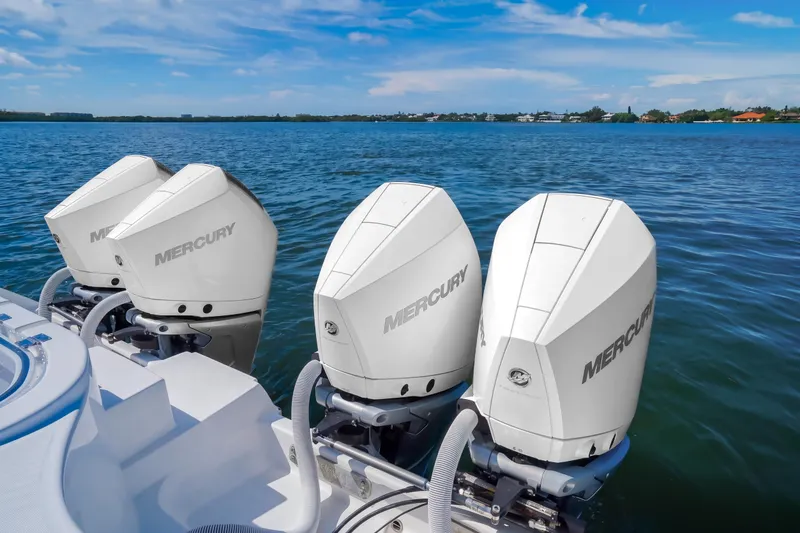 Slide: The Image of 2019 Invincible 37 Catamaran with four Mercury outboard engines on a calm sea. - 31