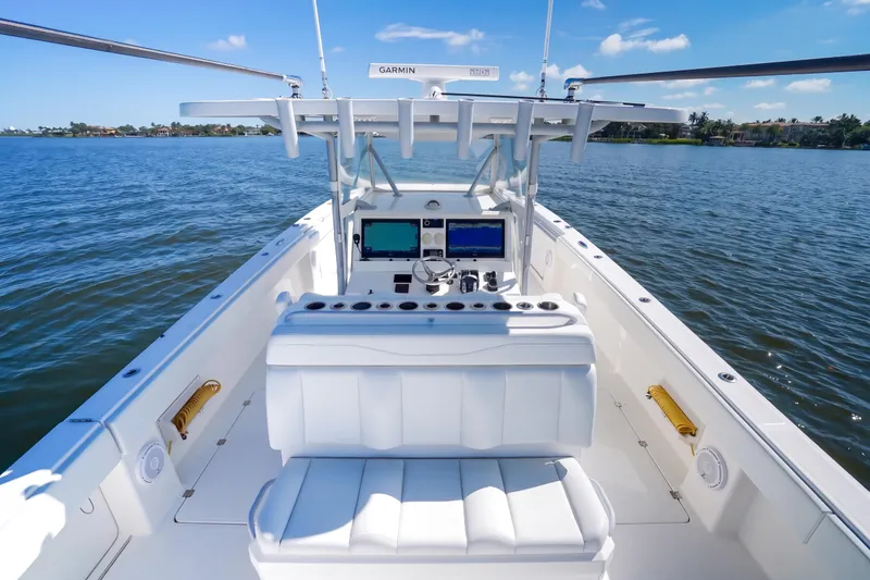 Slide: The Image of 2019 Invincible 37 Catamaran with advanced navigation system on calm waters. - 15