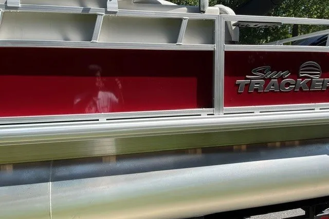 Slide: The Image of 2026 Sun Tracker Bass Buggy 18 DLX pontoon boat with red and silver exterior. - 19