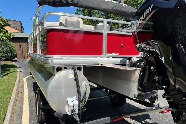 Slide: The Image of 2026 Sun Tracker Bass Buggy 18 DLX pontoon boat with Mercury outboard motor. - 17