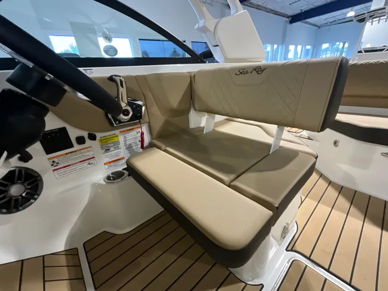 Slide: The Image of Interior view of a Sea Ray SDX 230 Outboard with beige seating and modern design. - 15