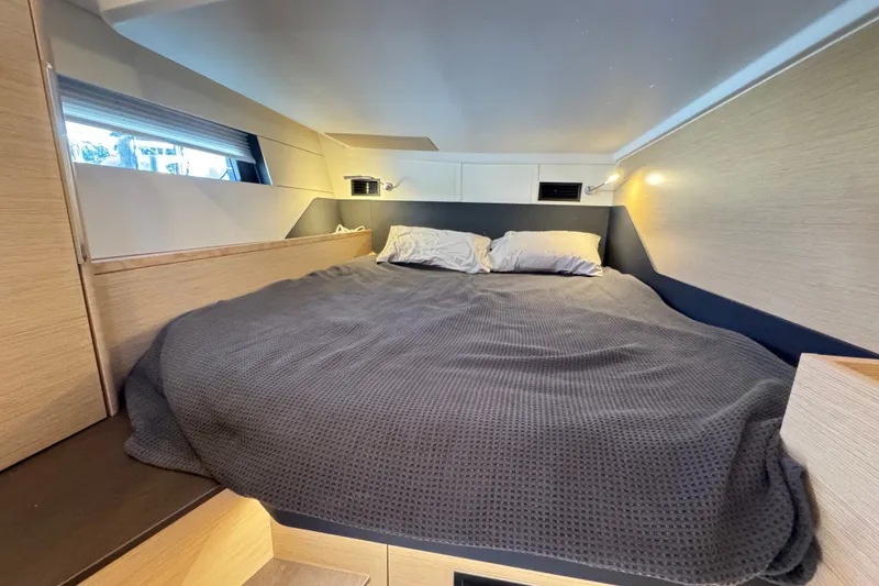 Slide: The Image of Cozy bedroom interior of 2025 Hanse 460 yacht with modern design and soft lighting. - 18