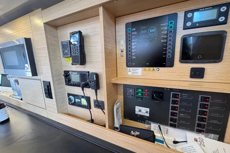 Slide: The Image of Control panel of a 2025 Hanse 460 yacht with navigation and communication equipment. - 15