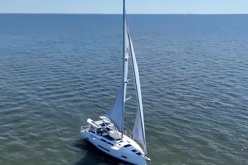 Slide: The Image of Sailing yacht Hanse 460, 2025 model, gliding on open sea under clear skies. - 7
