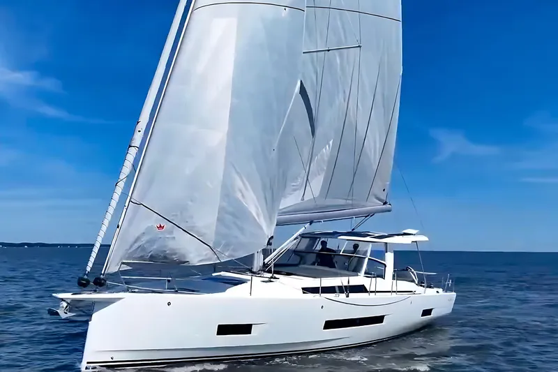 Slide: The Image of Sailing yacht Hanse 460, 2025 model, gliding on open sea under clear blue skies. - 2