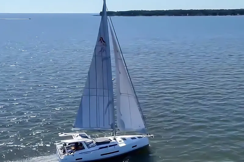Slide: The Image of Sailing yacht Hanse 460 (2025) gliding on open sea under clear blue skies. - 5