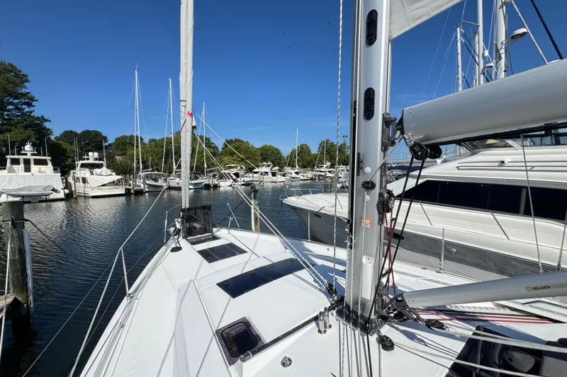 Slide: The Image of Sailing yacht Hanse 460 (2025) docked in a marina with other boats. - 11