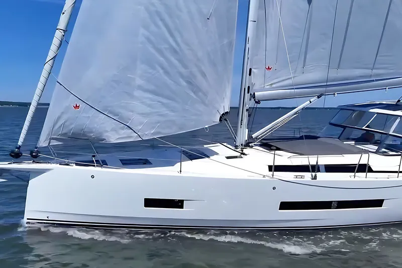 Slide: The Image of Sailing yacht Hanse 460, 2025 model, cruising on open water under clear blue skies. - 4