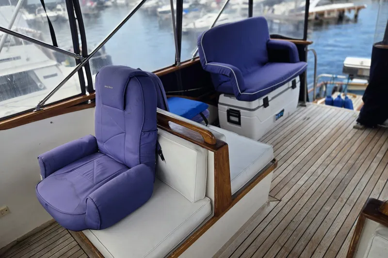 Slide: The Image of Interior of 1979 Ocean Alexander 40 Double Cabin with purple seating and wooden flooring. - 61