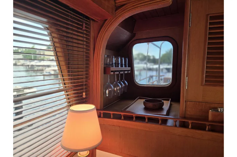 Slide: The Image of Interior of 1979 Ocean Alexander 40 Double Cabin with wooden accents and window view. - 29