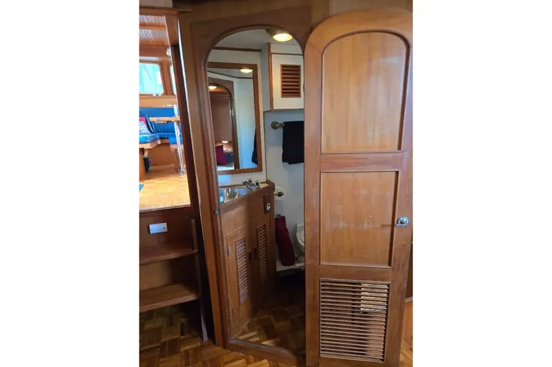 Slide: The Image of Interior of 1979 Ocean Alexander 40 Double Cabin with wooden cabinetry and bathroom. - 35
