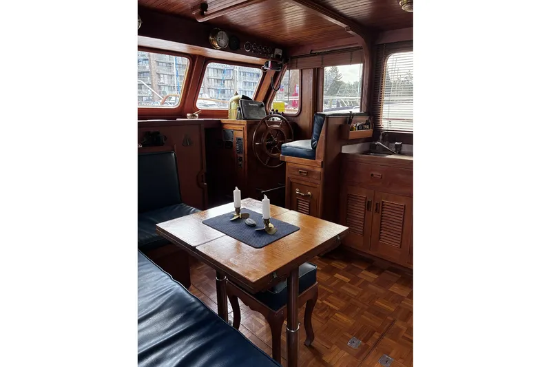Slide: The Image of Interior of 1979 Ocean Alexander 40 Double Cabin with wooden decor and steering wheel. - 12