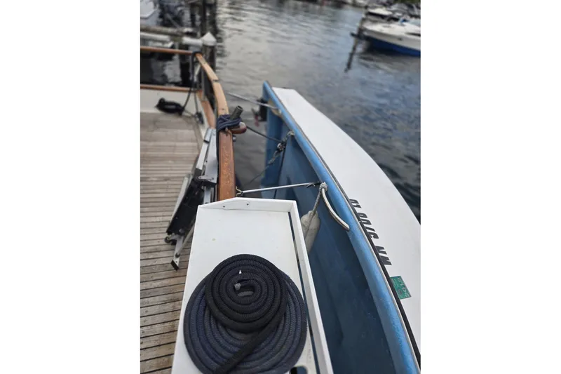 Slide: The Image of 1979 Ocean Alexander 40 Double Cabin docked, featuring deck and coiled rope. - 54