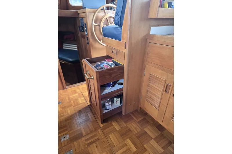 Slide: The Image of 1979 Ocean Alexander 40 Double Cabin interior with wooden cabinetry and open storage drawer. - 27