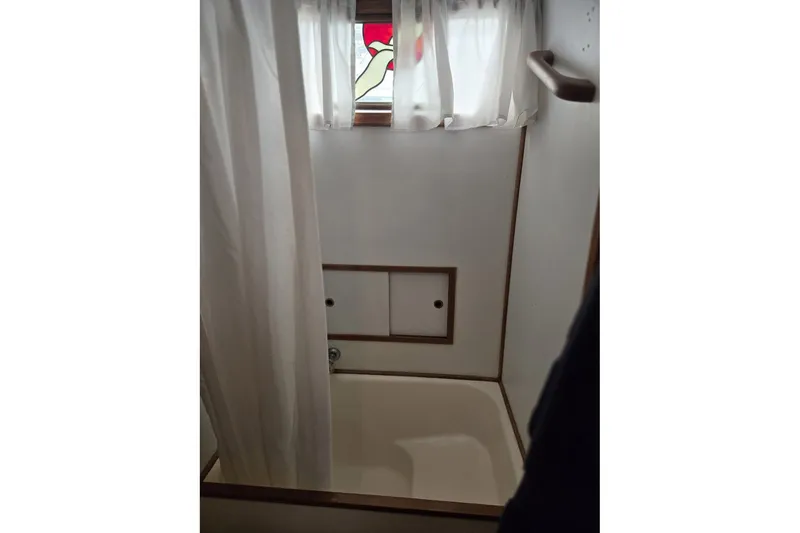 Slide: The Image of Shower area in 1979 Ocean Alexander 40 Double Cabin with curtain and small window. - 38