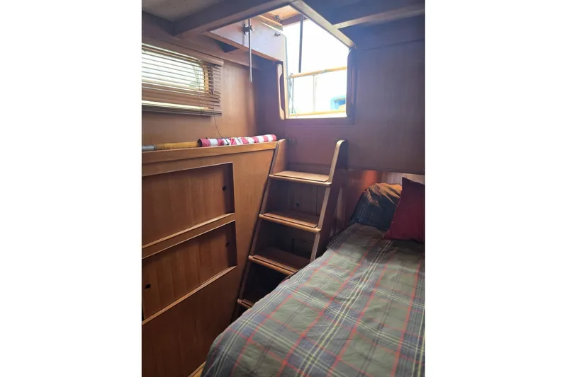 Slide: The Image of 1979 Ocean Alexander 40 Double Cabin interior with wooden ladder and bed. - 39