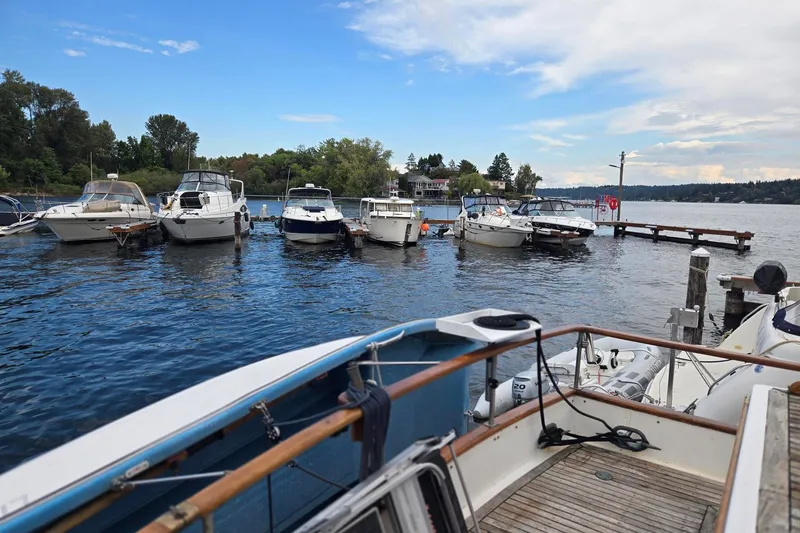 Slide: The Image of Boats docked at a marina, view from Ocean Alexander 40 Double Cabin, 1979 model. - 56